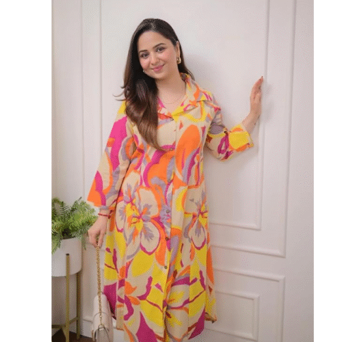 Close-up of flared anarkali kurta set for women showing Jaipuri prints, thread work on neck, and vibrant patterns on fabric for festive wear.