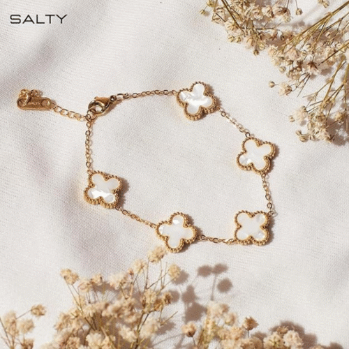 Minimalist female gold bracelet on jewelry holder